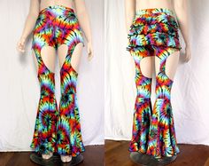 "These pants have everything: - high waist (rise measurement depends on size) - 3 layer ruffle butt - garter style legs - large circle flares - with more ruffles! Matching top coming soon! These are available in our select prints: Blue Galaxy, Fineapple, Neon Chevron (UV reactive), Rainbow Mermaid, Rainbow Tie Dye (shown - UV reactive), and Baelien. All are 4 way stretch spandex. These are currently available in standard sizing Small - 4X, standard inseam length 32\". See last photo for full siz Groovy Flared Bottoms For Summer, Groovy Flare Bottoms For Summer, Retro Flare Bottoms For Festival, Hippie High-waisted Fitted Pants, Fitted Hippie Flares For Summer, Groovy Flare Stretch Bottoms, Groovy Fitted Bottoms For Spring, Groovy Pants For Spring Festival, Summer Flare Bottoms With Ruffles