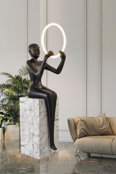 a statue with a circular light in it's hand