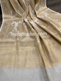 Gorgeous cotton silk white Banarsi dupatta with beautiful rose motifs in gold zari. Luxury Resham Embroidery Banarasi Silk Dupatta, Luxury Silk Thread Elegant Dupatta, Luxury Banarasi Silk Dupatta With Pallu, Luxury Formal Katan Silk Dupatta, Luxury Tissue Silk Dupatta With Pallu, Affordable Gold Dupatta With Zari Work, Luxury Fitted Dola Silk Dupatta, Festive Off-white Handloom Dupatta, Gold Cotton Silk Traditional Wear For Eid