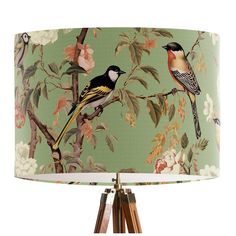 a lamp that has birds on it