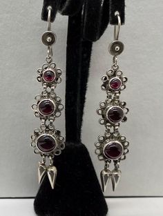 Beautiful Vintage Art Deco 925 Sterling Silver & Garnet Cabochon Dangle Earrings pre/owned condition measures 2.5" length. Silver Art Deco Gemstone Earrings, Vintage Silver Cabochon Earrings, Art Deco Sterling Silver Dangle Earrings, Nickel-free Dangle Art Deco Earrings, Silver Art Deco Clip-on Jewelry, Art Deco Earrings, Etsy Earrings Dangle, Vintage Art Deco, Garnet