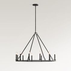 a black chandelier with six candles hanging from the center and four lights on each end