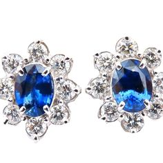 Cluster Halo Prime. 2.30 Carat Natural Oval Sapphires. Royal Blue, Clean Clarity And Transparent. 7.5 X 5.5 Mm Each. 1.33ct Natural Round Diamonds. G Color Vs2 Clarity 14kt White Gold 6 Grams. $12,000 Appraisal Certificate Will Accompany Elegant Blue Gia Certified Diamond Earrings, Classic Blue Oval Diamond Earrings, Luxury Platinum Blue Earrings, Luxury Blue Platinum Earrings, Classic Blue Platinum Earrings, Elegant Blue Platinum Earrings, Classic Blue Diamond Earrings For Formal Occasions, Blue Diamond Earrings For Formal Occasions, Sapphire Diamond Earrings