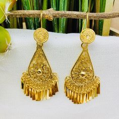 Beautiful and stunning handmade Mexican Filigree Earrings. Each piece is meticulously created out of copper wire and spun into a beautiful design. To give it the final touch artisans dipped into gold plate for it's gold color. This accessory is an important part of the traditional Tehuana outfit from Oaxaca, Mexico. Look elegant while wearing Mexico's culture with this one of a kind earrings! Approximate length: 3-3.5 in Need more than one? Ask us about our combined flat rate shipments for multi Traditional Dangle Clip-on Earrings With Latkans, Gold Drop Clip-on Earrings With Latkans, Ornate Chandelier Earrings For Festivals, Ornate Filigree Chandelier Earrings For Celebration, Traditional Filigree Chandelier Earrings, Traditional Gold Pierced Chandelier Earrings, Traditional Gold Flower Earrings For Festivals, Traditional Gold Chandelier Earrings, Handmade Ornate Chandelier Earrings For Festive Occasions