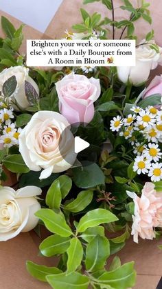 a bouquet of flowers sitting on top of a wooden table next to a sign that says, brighten your week or someone else's with a daily bouquet from a room in bloom