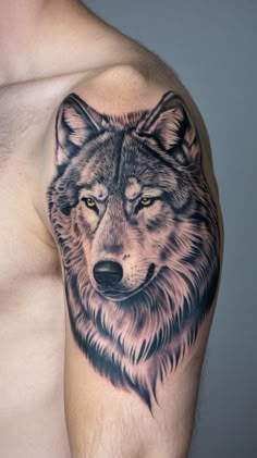 a man's arm with a wolf tattoo on it