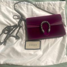 Gucci Evening Bag Purple Velvet Silver-Tone Hardware Leather Trim Chain-Link Shoulder Strap Crystal & Chain-Link Accents Suede Lining Snap Closure At Front Includes Dust Bag Gucci Pouch Bag With Dust Bag Included, Luxury Gucci Crossbody Shoulder Bag, Luxury Shoulder Bag With Dust Bag For Gift, Gucci Bag With Silver-tone Hardware For Party, Luxury Silver-tone Pouch Evening Bag, Gucci Shoulder Bag With Detachable Strap Clutch, Gucci Party Bag With Silver-tone Hardware, Chic Gucci Rectangular Bag, Gucci Evening Crossbody Shoulder Bag