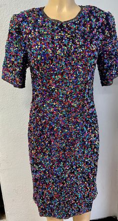 This sequin dress is handmade, high quality, original design and beautiful. This dress is suitable for party, events or any event. Multicolor Embellished Evening Dress, Elegant Multicolor Sequin Cocktail Dress, Embellished Multicolor Evening Dress, Glamorous Mini Sequin Dress For Festive Occasions, Glamorous Multicolor Cocktail Evening Dress, Festive Glitter Dresses For Party Season, Disco Style Embellished Mini Dress For Spring, Spring Party Sequin Dress With Contrast Sequin, Glamorous Mini Sequin Dress For Costume Party