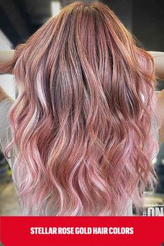 Rose gold hair with a Pink Lemonade hue on long hair with a brown base