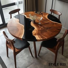 a wooden table with two chairs around it