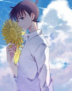 an anime character holding a sunflower in his hand