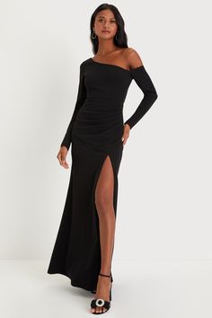 a woman wearing a black dress with thigh high slits and an off the shoulder top