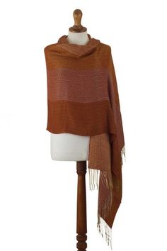 This vibrant wrap will work both as a shawl and a beautiful oversized scarf for cold winter days. Raquel and Gregor hand-weave it in a butter-soft baby alpaca blend and decorate it with a luxurious jacquard pattern in a warm combination of burnt orange amber and ochre tones. Raquel and Gregor aim to preserve their homeland's rich textile and weaving traditions through their work. Bohemian Alpaca Shawl For Fall, Fall Handwoven Alpaca Shawl, Alpaca Shawl For Fall, One Size Handwoven Alpaca Shawl, Alpaca Wrap Scarf One Size, One Size Alpaca Shawl For Fall, Winter Woven Shawl One Size, Winter Woven One-size Shawl, Orange Shawl Scarves For Fall