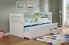 a child's bed with drawers underneath it