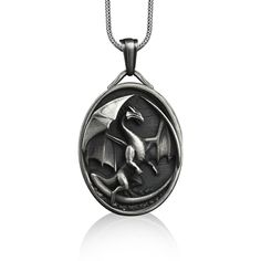 Dragon oval pendant necklace in sterling silver, Personalized fantasy necklace for best friend, Birthday gift necklace These 925K Sterling Silver Dragon with Open Wings Necklace has special handmade engraving details which photos are taken with original products. It's very elegant and classy for everyday use and gives stylish look to your outfits. Also, can be preferred as a gift for friends and family for an eternal memorial. Dream collection has many meanings behind its background; we prepare Fantasy Silver Necklace With Round Pendant, Fantasy Silver Round Pendant Necklace, Silver Round Pendant Necklace In Fantasy Style, Fantasy Style Oxidized Jewelry Gift, Fantasy Style Oxidized Jewelry As A Gift, Fantasy Oxidized Finish Jewelry As A Gift, Silver Jewelry With Engraving Option For Birthday, Fantasy Style Engraved Necklaces For Gifts, Silver Fantasy Necklace For Gifts