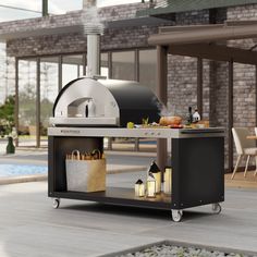 an outdoor bbq grill sitting on top of a patio