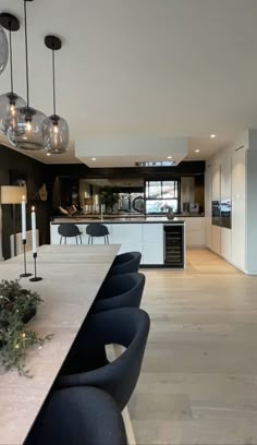 a large kitchen with black and white decor