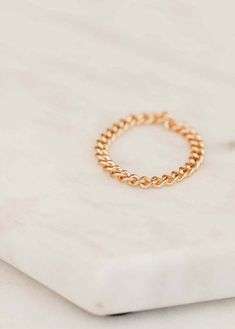 We love this chain ring worn individually for a simple adornment, or stacked for a stronger statement. 1.8mm band width. Available in 14kt Gold Fill. The larger of our two curb chains (smaller is the Stevie chain). Paired on Jess with our Confetti Ring stack, and Valley Trio.All of our jewelry is handmade to order just for you so each piece will be unique and may vary slightly from what is pictured. Due to the handmade nature of our products, items generally ship within 3-5 business days. Dainty Yellow Gold Chain Ring For Promise, Gold Stackable Chain Ring For Promise, 14k Gold Chain Ring Tarnish Resistant, Minimalist Round Chain Ring For Promise, Minimalist Round Chain Promise Ring, Stackable Yellow Gold Chain Ring For Promise, 14k Gold Open Chain Ring For Promise, Dainty 14k Gold Chain Ring For Promise, Minimalist Round Rings With Chain Details