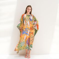 A classic ferns print on twill silk kaftan with one size fit all will be a perfect gift to her and also good for lounging home. It's flowy, soft and elegant touch.  FEATURES - Vintage prints elephants, and safari - Personal Custom Made - Full Length Kaftan Half-Sleeves - Designer Silk Kaftan - Plus Size and Custom Length - Resort Wear, Beach Wear, Lounge Wear, Pool Cover Up Kaftan - crew -------------------------------- DETAIL  * Length : 130 CM & Width 130 CM * Please note, we don't provide exact in dimension but will try best to reach the request, error 1-4 cm may occur due to fabric' nature, manually cutting & sewing, etc. -------------------------------- FREE Customization service - Cut shorter from the 130 CM  -------------------- FABRIC *Silk Twill 90% + 10 % Viscose ( The fabric is Patterned Kaftan For Summer Beach Cover-up, Yellow Kaftan For Beach Cover-up, Patterned Beachwear Maxi Dress For Beach, Summer Tropical Kaftan For Vacation, Bohemian Beach Dress With Leaf Print, Patterned Maxi Beach Dress, Tropical Green Kaftan For Beach Cover-up, Patterned Maxi Dress For Beach, Bohemian Leaf Print Dresses For Vacation