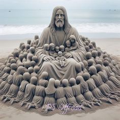 there is a sand sculpture of jesus surrounded by many small balls on the beach,