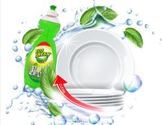 the dishwasher is surrounded by green leaves and has a bottle of detergent on it