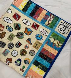 there is a quilt with many different patches on it