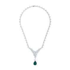 The Lydia Statement Necklace in Colombian Emerald Silver is a stunning piece of jewellery that exudes elegance and brilliance. It is adorned with simulated diamonds from end to end, culminating in a striking triangular formation at the front. At the tip of this dazzling triangle hangs a teardrop-shaped lab-grown Colombian Emerald, the birthstone for May, adding a touch of vibrant colour and deep significance. The Lydia Statement Necklace in Emerald Silver is perfect for a variety of occasions. W Luxury Emerald Pendant Necklace For Formal Occasions, Formal Crystal Gemstone Necklaces, Luxury Bridal Necklace In Diamond White Cubic Zirconia, Luxury Hand Set Emerald Necklace For Anniversary, Elegant White Gold Emerald Necklace With Brilliant Cut, Hand Set Emerald Pendant Necklace For Formal Occasions, Luxury Emerald Necklace With Diamond Accents For Formal Events, Exquisite Emerald Necklace With Diamonds For Formal Events, Fine Jewelry Diamond Necklace With Gemstones For Evening