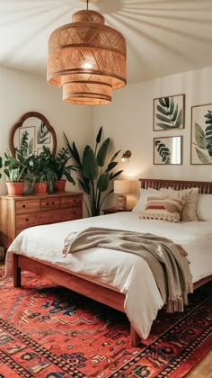 a bed sitting on top of a red rug next to a wooden dresser and lamp