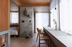 a room with wooden floors and white walls