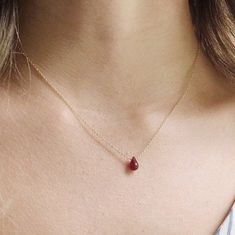 Minimalist Ruby Necklace, Dainty Ruby Jewelry, July Birthstone Necklace, Genuine Ruby Necklace This July birthstone necklace features a genuine ruby on a simple chain available in gold filled, rose gold, sterling silver and 14k gold. Lightweight and simple, this tiny ruby necklace is great as an everyday necklace and perfect for layering with other necklaces.  Jewelry is handmade by us in NYC focusing on quality using only the highest quality materials and handpicked genuine gemstones.  The length on the model is 16 inches.  ▹ PACKAGING All jewelry is beautifully wrapped in tissue and placed in a kraft box with a card inside a logo drawstring pouch. This makes for great gift giving.  ▹ F A Q  What is 14k Gold-Filled?  Gold-filled is the next best option to 14k solid gold. It is a less expe Dainty Ruby Necklaces, Dainty Ruby Birthstone Necklace, Elegant Ruby Birthstone Necklace, Minimalist Ruby Birthstone Necklace, Red Minimalist Birthstone Necklace, Dainty Ruby Necklace For Gift, Dainty Round Ruby Necklaces, Minimalist Red Gemstone Birthstone Necklace, Polished Ruby Necklace For Gift