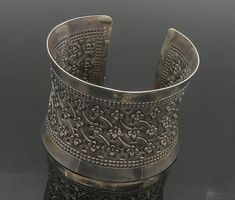 925 Sterling Silver - Vintage Flower Patterned Dark Tone Cuff Bracelet - BT7318  925 Sterling Silver - Vintage Flower Patterned Dark Tone Cuff Bracelet - BT7318  Jewelry Type:         Bracelet   Metal Type:            925 Silver  Metal Size:             6.75" Length  2" Height   Stone Type:            N/A  Condition:              N/A  Jewelry Weight:     67.8 Grams  PLEASE NOTE: THIS ITEM IS PRE-OWNED. ALTHOUGH MOST ITEMS ARE IN VERY GOOD CONDITION, SOME MAY NEED CLEANING AND/OR MINOR REPAIRS. WE MAKE A VERY STRONG EFFORT TO UPLOAD CLEAR PICTURES. PLEASE INSPECT ALL PICTURES AND ASK ALL QUESTIONS YOU MAY HAVE PRIOR TO MAKING A PURCHASE. NOT ALL STONES ARE GENUINE, SOME ARE ENHANCED OR CREATED. Luxury Victorian Sterling Silver Bracelet, Luxury Ornate Sterling Silver Bangle, Luxury Antique Style Sterling Silver Bangle, Silver Jewelry Aesthetic, Silver Celtic Jewelry, Funky Jewellery, Clear Pictures, Bracelet Metal, Jewelry Aesthetic