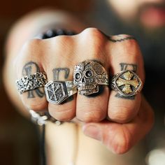 Introducing the Layered Cross Ring—a bold statement piece in two-toned sterling silver and brass accents that showcase strength and excellence. This eye-catching cross of servitude is sure to add a bold transformation to your wardrobe. Derived from a symbol of loyalty, honor and brotherhood in battle, and more recently worn by outlaw motorcycle bikers, it has come to signify a rebellious nature, making it an ideal choice for someone looking to inject a unique style into their wardrobe.Change the Punk Style Silver Cross Pendant Jewelry, Vintage Sterling Silver Cross Ring, Gothic Skull Ring For Streetwear, Skull Cross Ring, Symbolic Sterling Silver Cross Rings, Loyalty Symbol, Layered Crosses, Wardrobe Change, Cross Ring