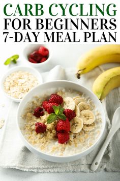 a bowl of oatmeal with raspberries and bananas on the side