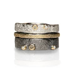 Bedrock Stacking Bands by Jenny Reeves (Gold, Silver & Stone Ring) | Artful Home Silver Stone Ring, Black Gold Jewelry, Stacking Bands, Silver Jewelry Design, Artful Home, Textured Ring, Contemporary Jewelry, Sterling Silver Bands, One Set