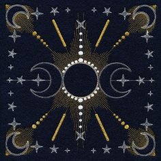 a black square with gold and white designs on it's sides, surrounded by stars