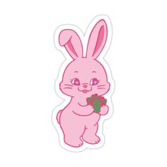 a pink bunny holding a piece of food