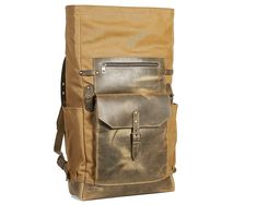 "This simple and elegant waxed canvas and leather backpack was made in the best traditions of minimalist clear design. It's an ideal bag for daily use, work and studying. Interior. * A plain dyed lining developed for waxed canvas luggage. the 100% cotton. * 1 zippered and 2 open pockets. * padded section for laptop or tablet Big and comfortable front pocket for quick excess outside. Suitable for notebook, power bank/battery, napkins, etc. The shoulder straps are padded and made of leather and ca Canvas Backpack With Leather Patch For Outdoor Activities, Waxed Canvas Backpack For Hiking, Khaki Leather Backpack For Outdoor Activities, Waxed Canvas Backpack With Canvas Lining For Hiking, Rugged Travel Backpack With Canvas Lining, Leather Hiking Backpack With Canvas Lining, Leather Backpack With Canvas Lining For Hiking, Khaki Waxed Canvas Backpack For Outdoor, Rugged Canvas Backpack With Canvas Lining