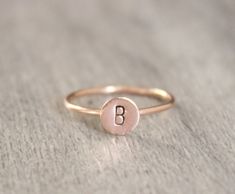 Simple initial stacking ring. Made with 14k gold filled or sterling silver. Please put your initial request in the notes at checkout. This ring is made to order in your size. If you don't see your size available please feel free to message me. All orders ship in a gift box. If you are ordering multiple items and want them boxed separately, please let me know in the notes at checkout. I ship via USPS. Please review the estimated delivery date and processing times. Processing times vary based on h Everyday Rose Gold 14k Initial Ring, Classic Adjustable Initial Ring In Rose Gold, Minimalist Rose Gold Initial Ring With Polished Finish, Customizable Rose Gold Initial Ring For Gift, Rose Gold Hallmarked Initial Ring For Gift, 15 Rings, Gold Initial Ring, Rose Gold Initial, Letter Ring