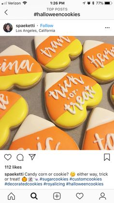 some cookies that are sitting on top of a table with the words happy halloween written on them