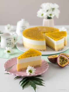 two pieces of cheesecake on plates with flowers