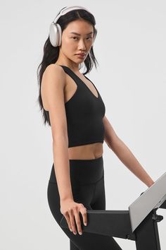 When you want the coverage of a tank and the support of a bra, reach for this. The Real Bra Tank has wide straps, a flattering V-neck, a built-in shelf bra and a racerback. Made from our signature Airbrush fabric that’s super soft with medium compression, you’ll go from Pilates to perusing the farmers market without missing a beat. Supportive Tank Top With Built-in Bra For Training, Black Tank Top With Wide Adjustable Straps, Racerback Tank Top With Built-in Bra For Yoga, Yoga Tank Top With Built-in Bra And Racerback, Alo Yoga Fitted Sleeveless Tank Top, Fitted Sleeveless Alo Yoga Tank Top, Black Bra Friendly Tank Top, Pilates Racerback Crop Top, Functional Racerback Tank Top, Bra Friendly