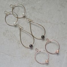 "White Freshwater Pearl Earrings~ These elegant sterling silver hoop earrings with a freshwater white pearl will look great for any occasion. Hammered and polished to a beautiful shine. Choose hoop size 1\" or 1.5\" Also available in 14k gold fill~ https://www.etsy.com/listing/199753367/white-pearl-hoop-earrings-small-gold?ref=shop_home_active_4 Also available with peacock pearls~ https://www.etsy.com/listing/269037112/peacock-pearl-earrings-freshwater-pearls?ref=listing-shop-header-0 Shop~bhttp Silver Teardrop Hoop Earrings With Pearl Charm, Silver Teardrop Pearl Hoop Earrings, Silver Hoop Jewelry With Pearl Drop, Silver Small Hoop Pearl Earrings For Wedding, Elegant Wire Wrapped Hoop Earrings For Anniversary, Silver Pearl Hoop Jewelry, Surfer Girl Gifts, Peacock Pearls, Crystal Point Necklace