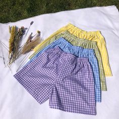 "These high waisted Gingham shorts are perfect for the spring! They have an elastic waistband with two lines of top stitch for a sporty yet elegant look. (1/4\" Gingham) Gingham shorts are approx 43cm long (can be made longer/shorter) - polycotton -Machine Washable Check out our website for more! https://eccentriclothing.bigcartel.com/products Instagram @eccentricclothing" Summer Plaid Shorts With Built-in Shorts, Cotton Gingham Pajama Shorts With Elastic Waistband, Gingham Cotton High-waisted Shorts, High-waisted Gingham Cotton Shorts, Casual Gingham Shorts With Elastic Waistband, Gingham Cotton Summer Shorts, Summer Gingham Cotton Shorts, Summer Cotton Gingham Shorts, Cotton Bottoms For Picnic, Short Length