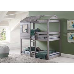 a child's bedroom with bunk beds and green walls