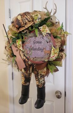 a wreath that says gone hunting on it