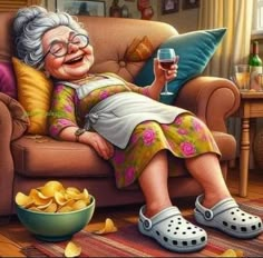 an older woman sitting on a couch with a glass of wine and chips in front of her