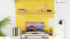 a desktop computer sitting on top of a desk next to a plant and bookshelf