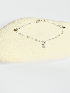 This pretty bracelet features three dainty hearts - two gold and one silver. It is simple enough to be worn everyday but would also be a lovely addition to a more formal outfit as the hearts catch the light for a little sparkle! The hearts each measure 0.4cm in length, the bracelet measures 18cm in total length. All silver elements are sterling silver; the gold is gold plate. I can provide this piece with a magnetic clasp if preferred to the clasp pictured (due to the cost of the clasp there is Everyday Sterling Silver Double Heart Bracelet, Everyday Double Heart Sterling Silver Bracelet, Sterling Silver Double Heart Bracelet For Everyday Wear, Dainty White Gold Sterling Silver Heart Bracelet, Dainty Sterling Silver Heart Bracelet, Delicate Silver Bracelets With Heart Charm, Dainty Heart-shaped Sterling Silver Bracelet, Dainty White Gold Heart Bracelet In Sterling Silver, Dainty Heart Bracelet In Sterling Silver White Gold