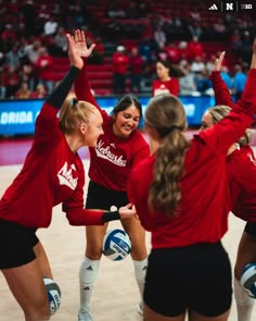 the volleyball team is celebrating their victory over the other team in a volley ball match