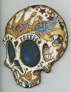 a ceramic skull with an ornate design on it